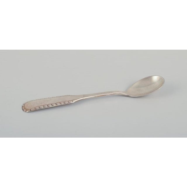 Georg Jensen, Cohr, and other Danish silversmiths. Five coffee spoons and a marmalade spoon in Sterling silver and 830...