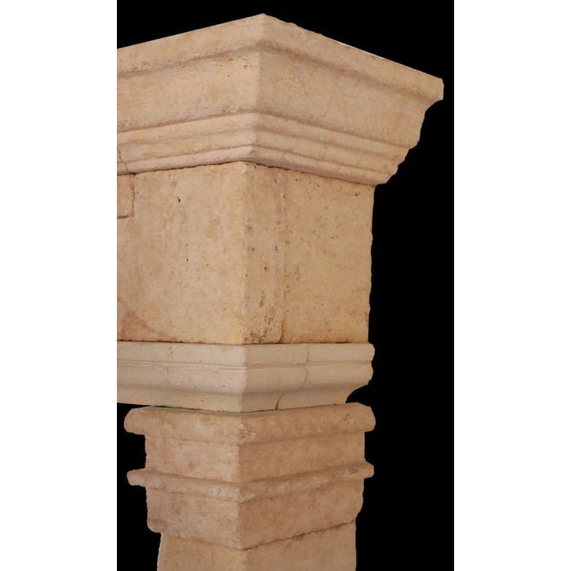 A classic example of understated French craftsmanship, this 20th-century limestone fireplace features clean, architectural...