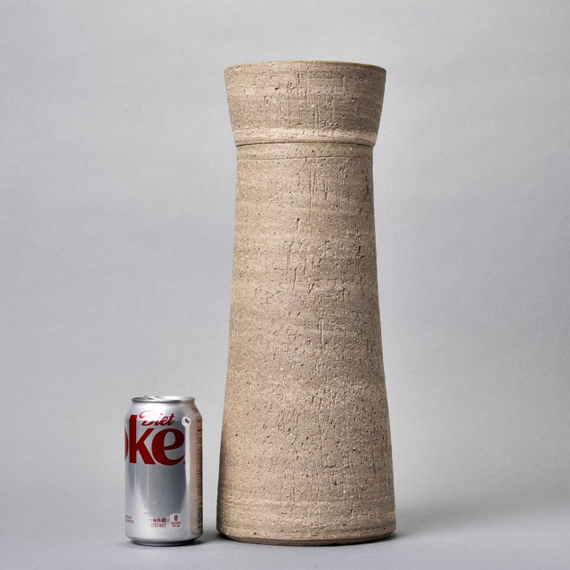 New and found in Germany, this rustic lidded ceramic vessel stands 16” tall. We love the textured surface and matte glaze...