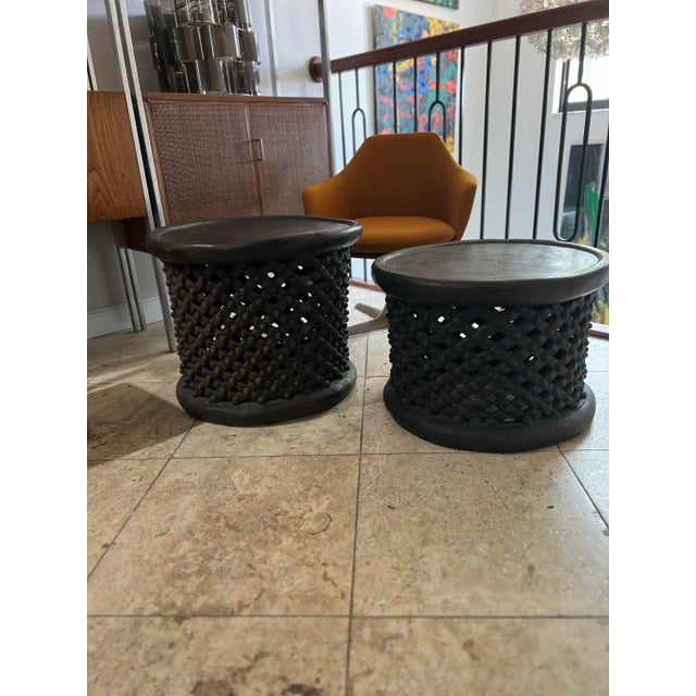 Pair of African Spider Bamileke Wood Table/ Stools; circular drum shape with stunning lattice geometric open work design,...