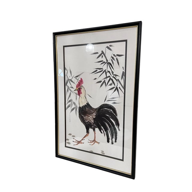 Lovely watercolor depicting a rooster surrounded by bamboo. Framed and signed.