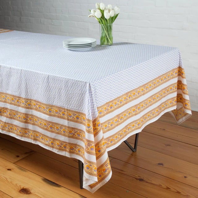 The contemporary Juhi chevron design with a zigzag pattern in cool periwinkle stands out beautifully against a floral vine...