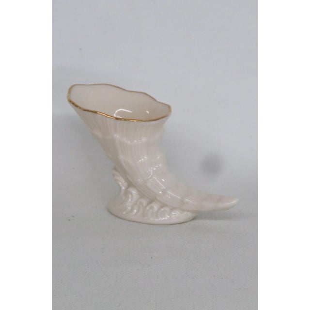 This charming Cornucopia Figurine is made of porcelain. This lovely small figurine is stamped as being made in the USA by...