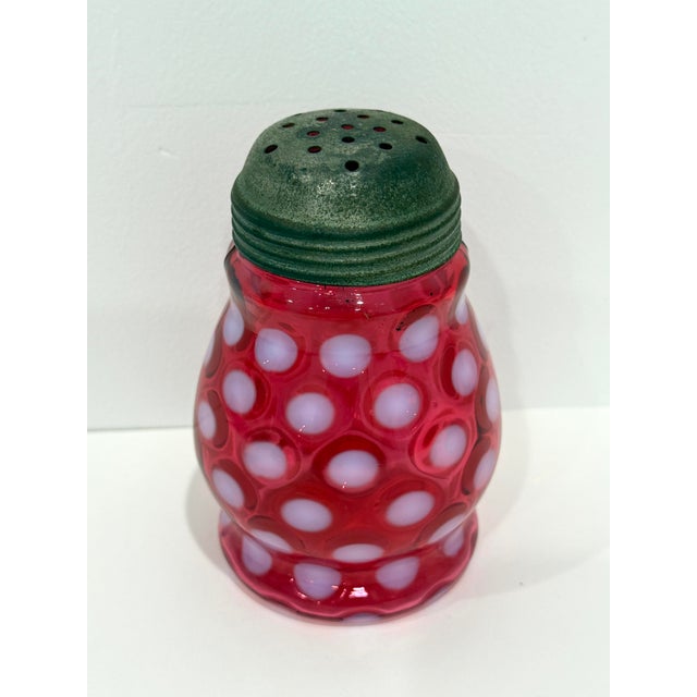 Vintage 1940-1960s Fenton Cranberry Red Opalescent Coin Dot Sugar Shaker Muffineer With Lid. The upper rim is rough, as...