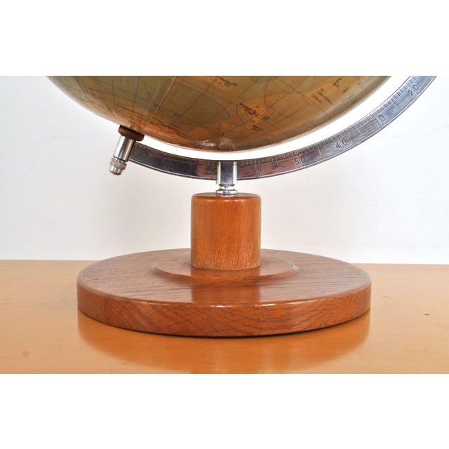 Beautiful political globe by Räths, Dutch edition. Made of paper-mâché. Metal protractor and hardwood base. 1950s. In very...