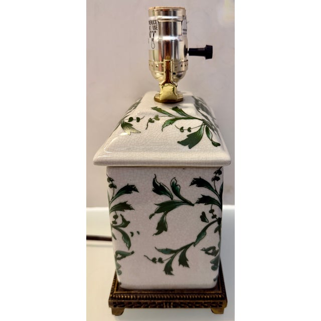 Small, Chinoiserie ginger jar style lamp with a beautiful, vivid, forest green and white Chinese design. The body of the...