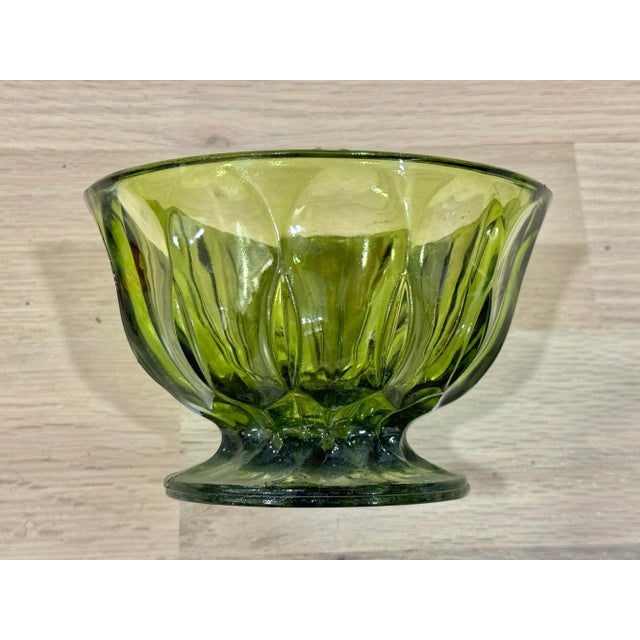 Lovely vintage green glass bowl. Beautiful design. Perfect to put potpourri or candies in. This is a pre-owned item so...