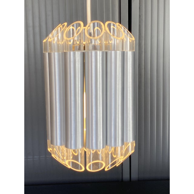 Very rare raak lamp composed of 12 aluminum shafts, each with a slanted acrylic glass diffuser at its end. model septiem...