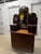 Victorian-style dressing table or vanity dresser featuring a tall, central mirror flanked by two smaller mirrors and...