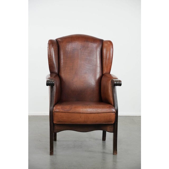 We are offering this classic vintage sheepskin and wooden wing chair with a beautiful finish and warm colors. This super...