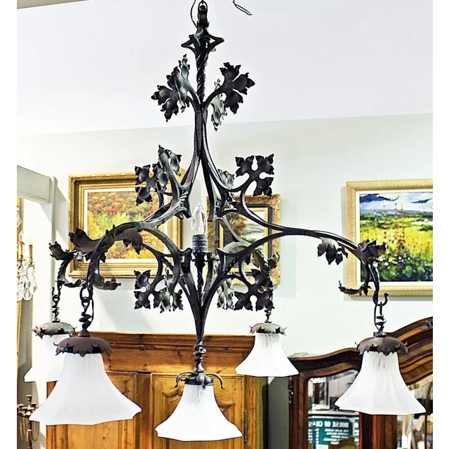 19th-century wrought iron and hand hammered oak leaf six-light chandelier by noted museum-featured French iron maker,...