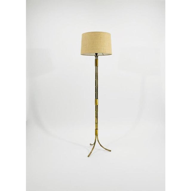 Triple-branch faux bamboo floor lamp in bronze by Maison Bagues, with coiled brass wire. Sold with or without lampshades,...