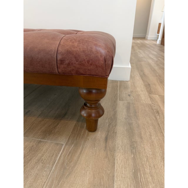 A great versatile tufted leather bench or ottoman that also could work well as a coffee table. Put your feet up to relax...