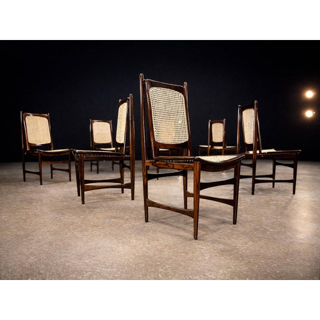 This rare set of ten dining chairs, designed in the 1960s by Alexandre Rapoport, exemplifies the refined elegance and...