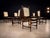 This rare set of ten dining chairs, designed in the 1960s by Alexandre Rapoport, exemplifies the refined elegance and...