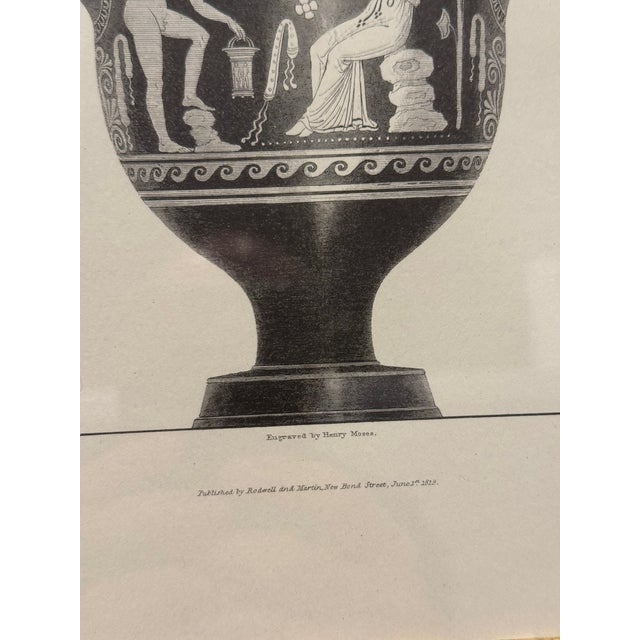 A refined pair of neoclassical engravings depicting classical Greek vases, each featuring finely rendered figural scenes...