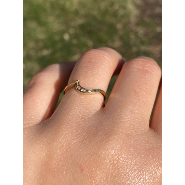 The Compi: Natural Diamond Wave Ring in Yellow Gold. This ring beautifully captures the fluidity of a gentle wave with its...