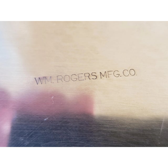 Lovely, detailed silver-plate butler tray with detailed etched designs in the rim and on the plate. Marked on the bottom,...