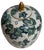 Crafted from porcelain featuring hand-painted botanical or floral designs. The jar includes a white base decorated with...