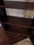 Ethan Allen “Transom” étagère bookcase in a rich dark wood finish, featuring clean, architectural lines and an open-back...