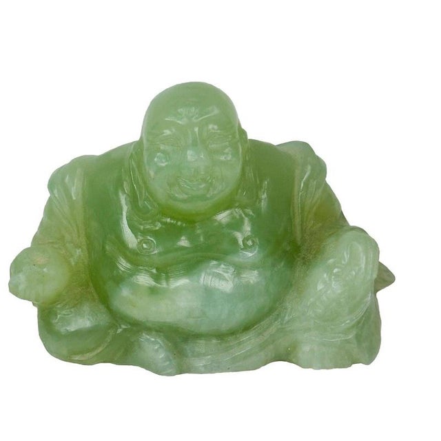 A hand-carved Chinese pale green jade figure portraying the seated Maitreya Buddha, commonly known as Budai or the...