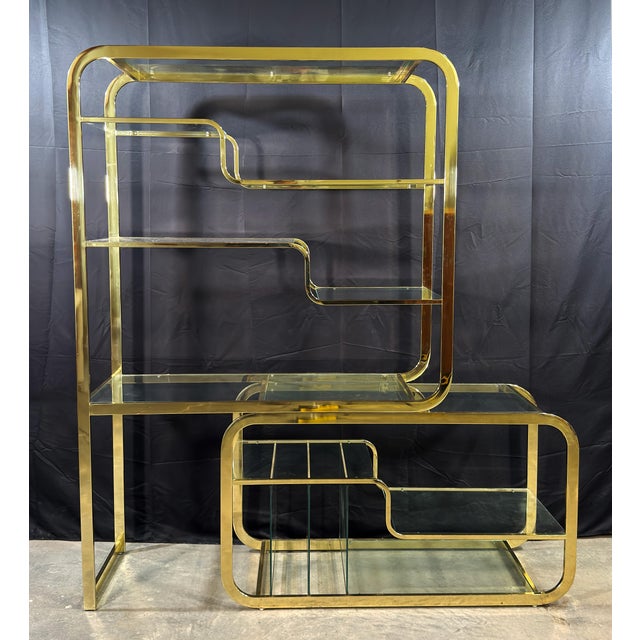 This adjustable golden brass and glass etagere by Milo Baughman for the Design Institute of America is one of the more...