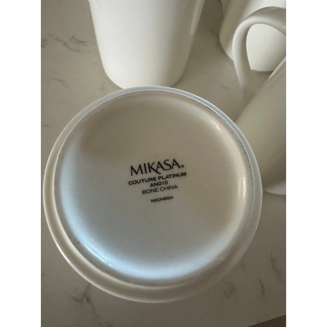 66 piece set. No chips or cracks. White square with silver trim. 11 dinner plates 10 1/2” 12 salad plates 7 7/8” 18 salad...
