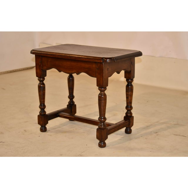19th century oak stool from England with pegged construction. The top has beveled edges and chamfered corners for added...