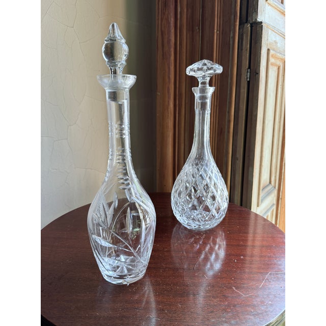 Mid century modern cut crystal wine decanter with a bulbous base and long slender neck, designed for aeration and pouring....