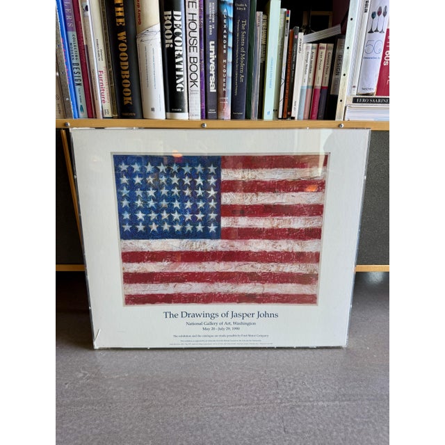 This vintage 1990 lithograph exhibition poster features the work of American Neo-Dada and Pop Art practitioner Jasper...