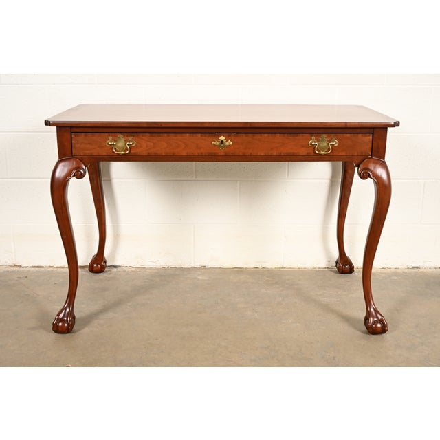 A gorgeous Chippendale or Georgian writing desk By Baker Furniture USA, Circa 1960s Beautiful book-matched carved...
