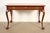 A gorgeous Chippendale or Georgian writing desk By Baker Furniture USA, Circa 1960s Beautiful book-matched carved...