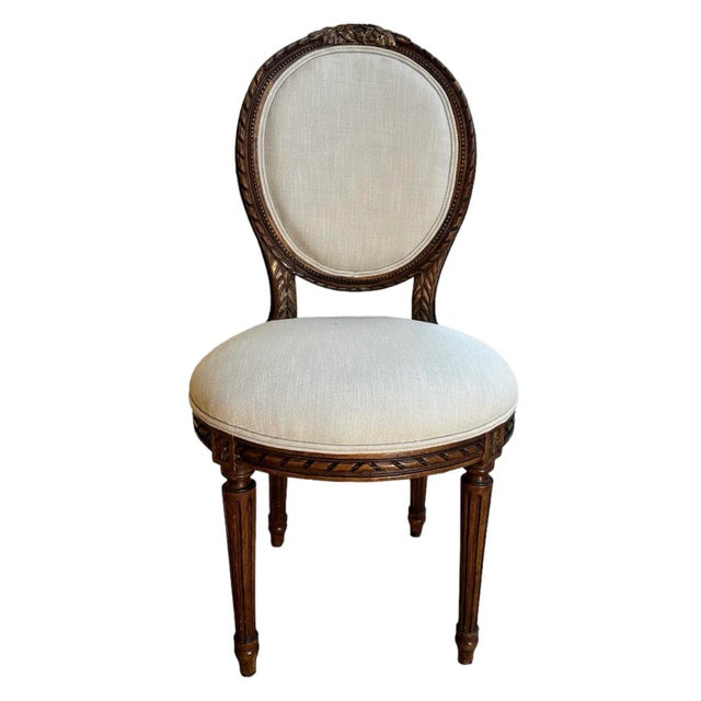 Louis XVI style walnut side chairs from Paris apartment. From Paris VII. Has been reupholstered.