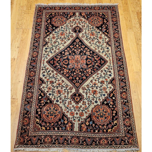 "A beautiful late 19th century Persian Farahan Sarouk area rug, finely hand-knotted with a Persian Garden floral design of...