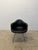 Single black stitched Naugahyde over moulded fiberglass shell DAX chair by Charles and Ray Eames for Herman Miller. This...