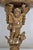 XVIIIth century. Small wall console in stuccoed and gilded wood, the scalloped top supported by Zéphir. Lacks Height 14,17...
