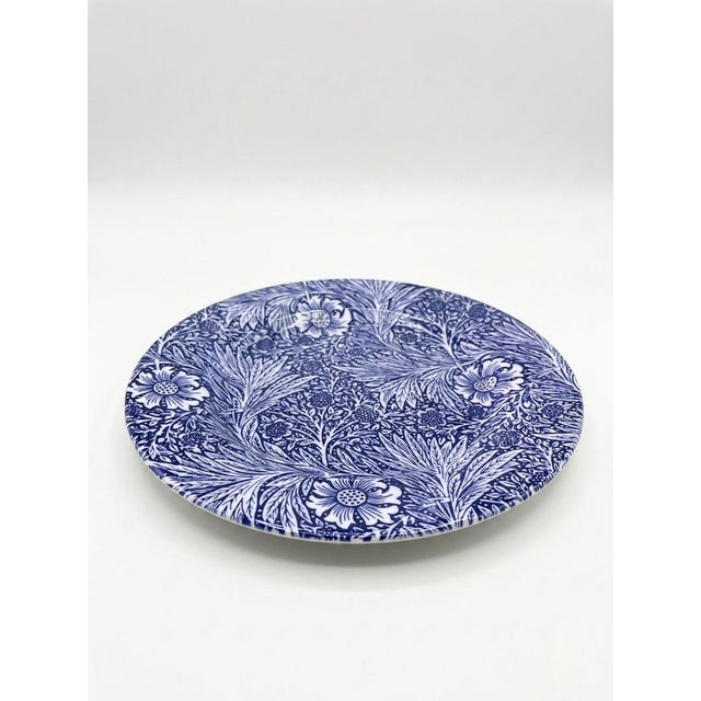 This sophisticated set of four ceramic plates features the iconic "Marigold" pattern, a hallmark of the Arts & Crafts...