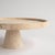 Put your delectable desserts on a pedestal with this gorgeous travertine cake stand from Kiwano. Hand crafted by Turkish...