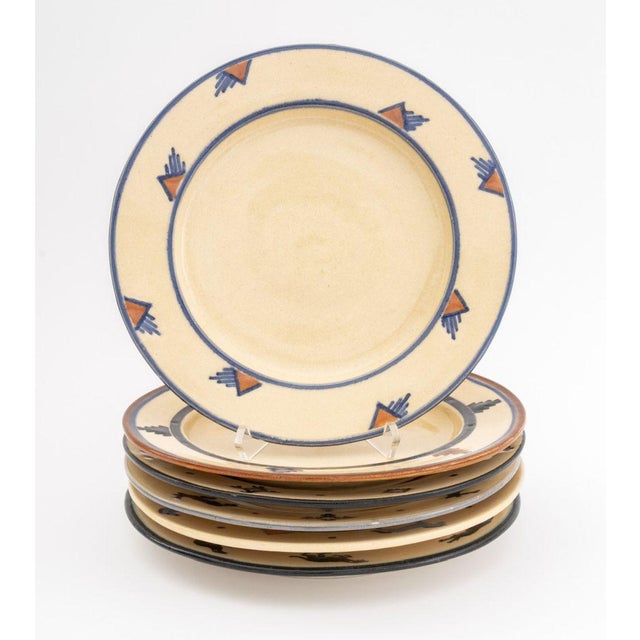 Collection of 24 Southwestern Glazed Art Pottery Tableware Pieces, with hand-painted geometric trim, comprising: (6) six...