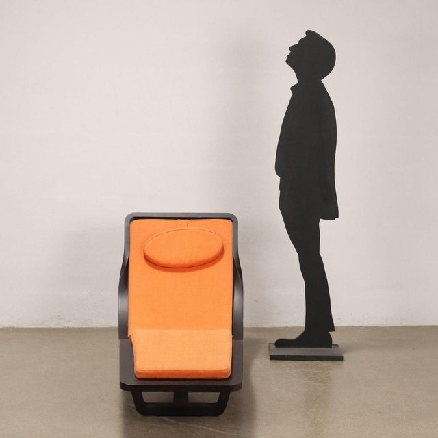 Chaise longue with stained solid wood structure and foam seat covered in orange fabric in excellent original condition....