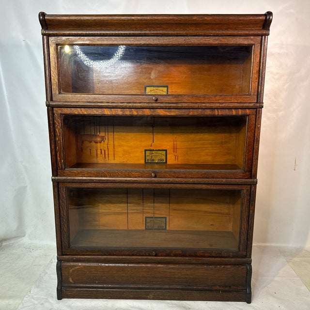 Early 1900s 3 stackable oak lawyers bookcase with original finish and in great shape with very slight finish issues due to...