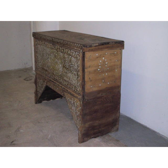 Antique Middle Eastern dowry chest constructed of wood with extensive mother-of-pearl and abalone inlay across all primary...