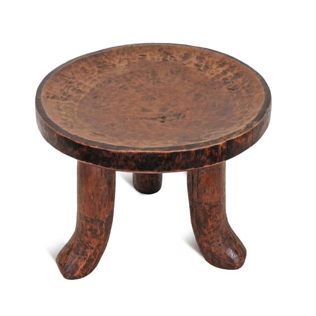 Vintage Luo stool from Central Africa area. Simple modern design with three bent legs and round stool top. Wonderful as a...