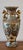Bring refined global elegance to your home with this exquisite Royal Satsuma porcelain urn vase, beautifully hand-painted...