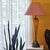 Elegant vintage Murano-style amber art glass table lamp with a sculptural hand-blown glass body, antique brass-tone metal...