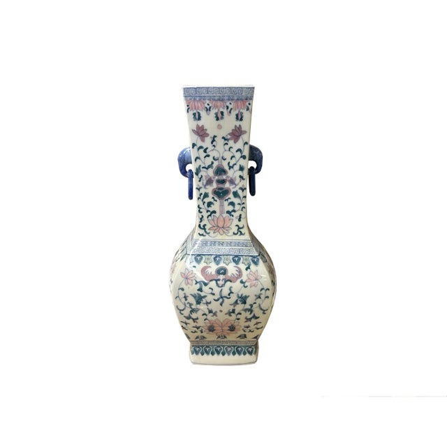 The Vintage Oriental Porcelain Vase is a stunning piece of artistry that seamlessly combines traditional craftsmanship...