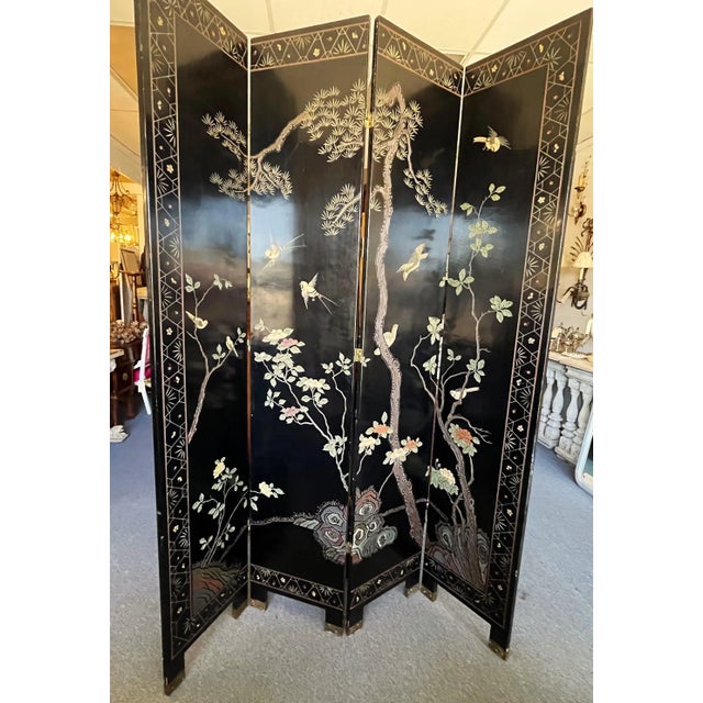 Timeless vintage four panel floor screen. The artisan piece is made in the coromandel style with ebony matte lacquered...