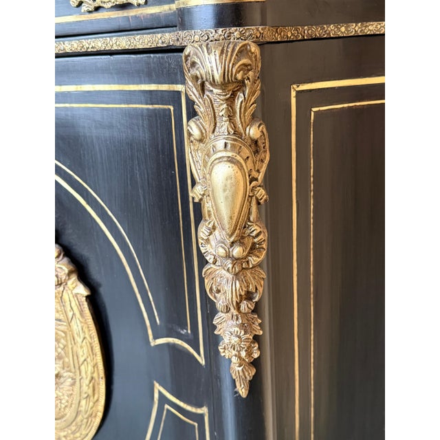 This 19th-century cabinet is a beautiful example of the Napoleon III style, characterized by elegance and refinement. It...
