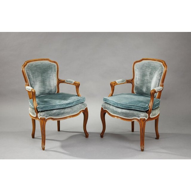 Two rococo style armchairs, characterized by lightness and movement. Their sinuous and asymmetrical shape reflects the...