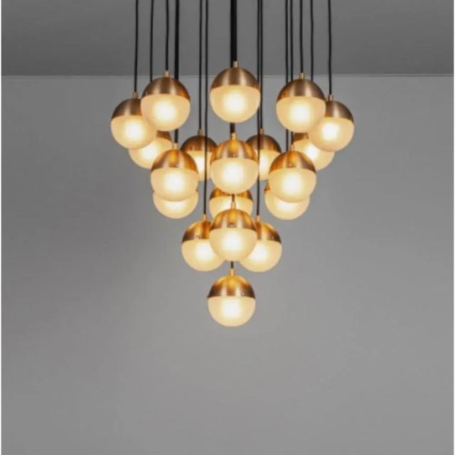 Molecule cluster 19 chandelier by Schwung Dimensions: D 63 x H 113, 3 cm Materials: Brass, Opal glass Weight: 20.9 kg...